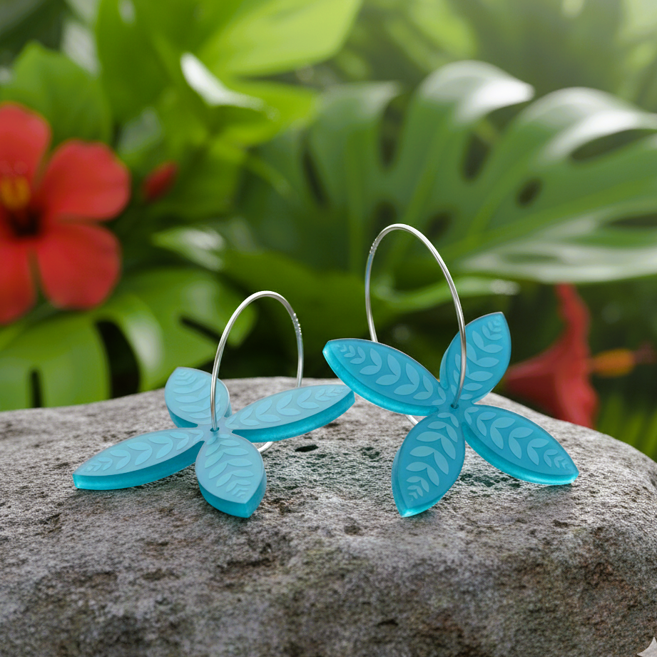 Frangipani Leaf hoop earrings on rock with flowers; aqua acrylic pair.