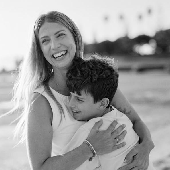 Sam and Hugo Donaldson, hugging, black and white.