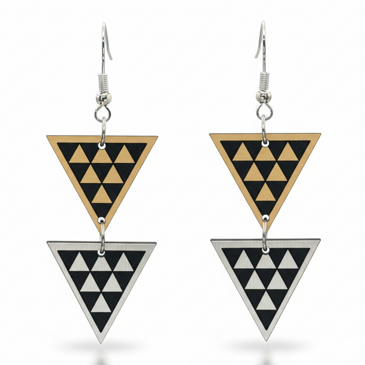 Tāniko Double earrings, stacked triangles with tāniko pattern in brushed gold and brushed silver metallic.