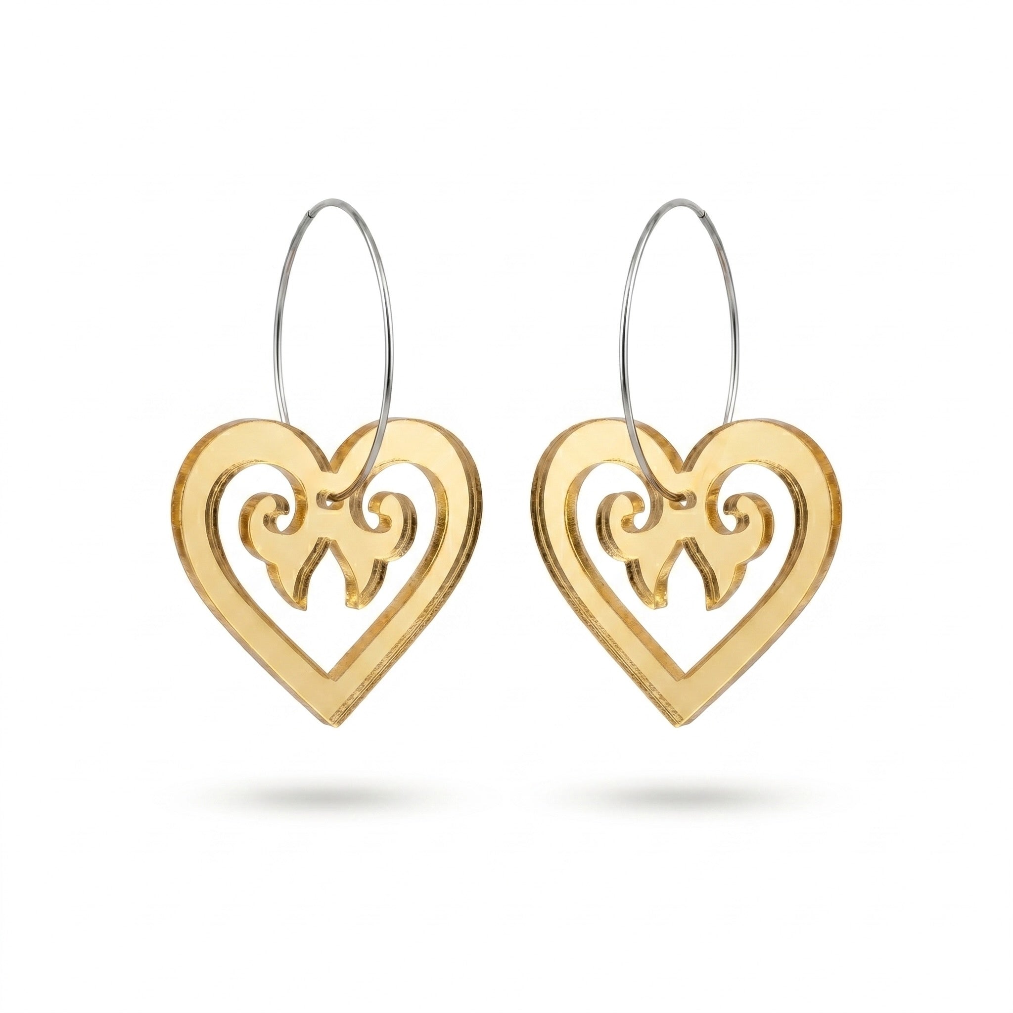 Aroha Heart Open earrings, open heart with koru scrollwork on a silver hoop in gold mirror.