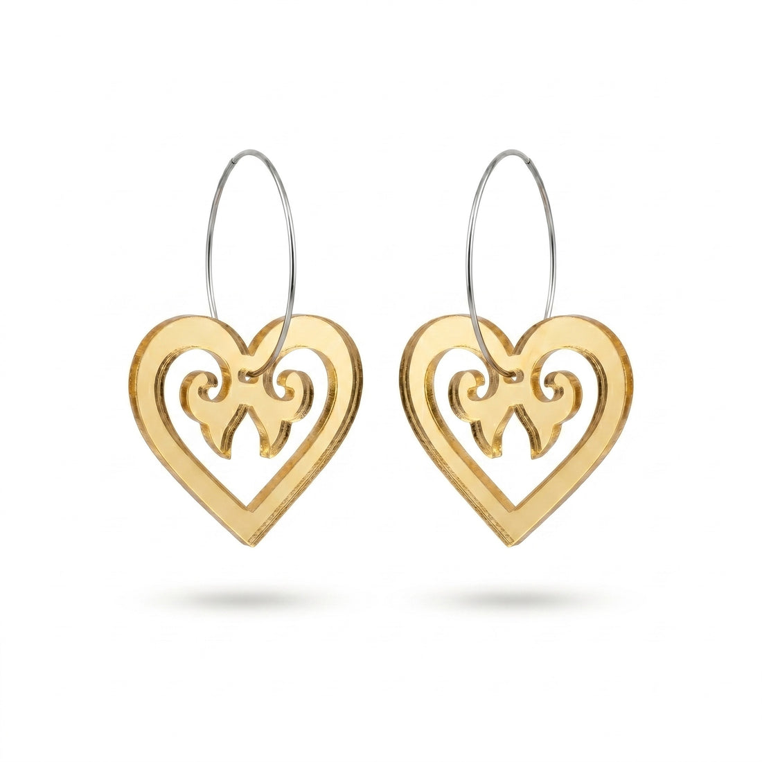 Aroha Heart Open earrings, open heart with koru scrollwork on a silver hoop in gold mirror.