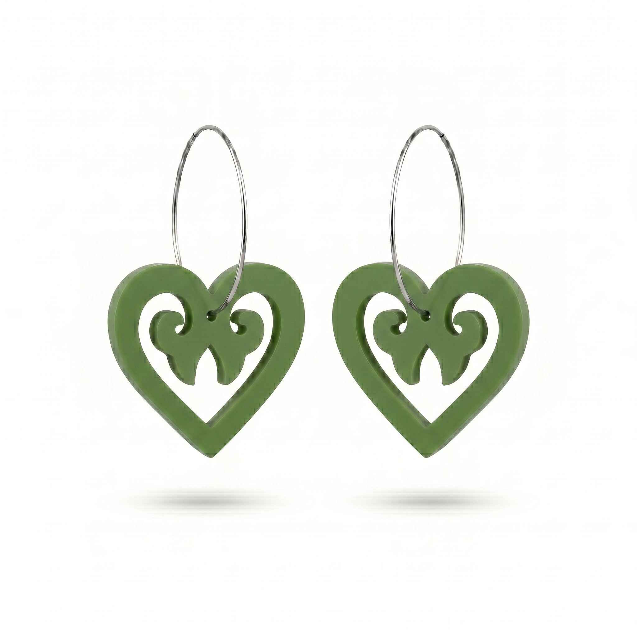 Aroha Heart Open earrings, open heart with koru scrollwork on a silver hoop in pounamu satin.