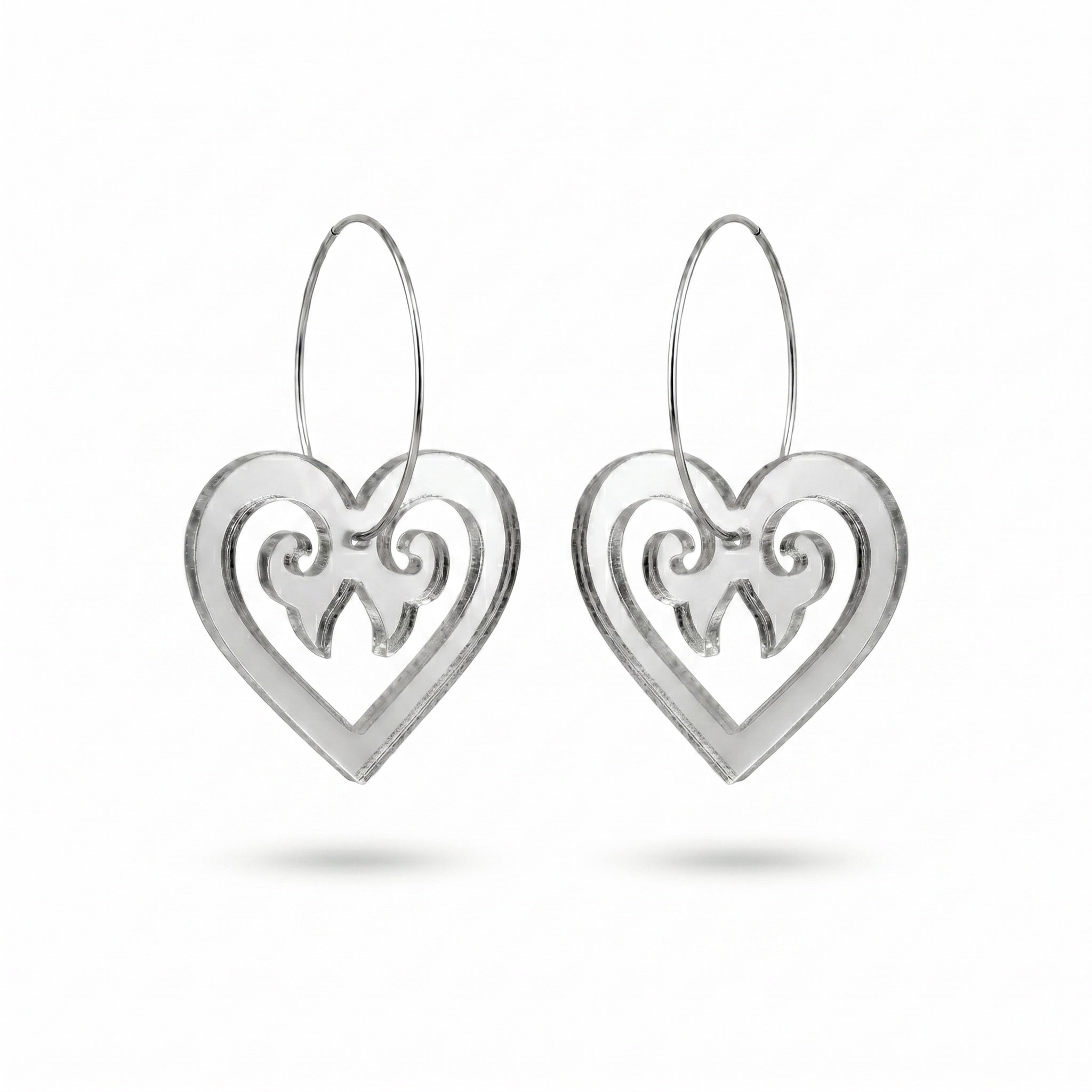 Aroha Heart Open earrings, open heart with koru scrollwork on a silver hoop in silver mirror.