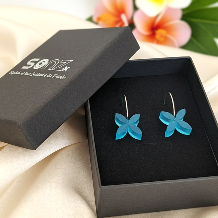 Frangipani Small hoop earrings in SoNZ gift box; aqua acrylic four-petal.
