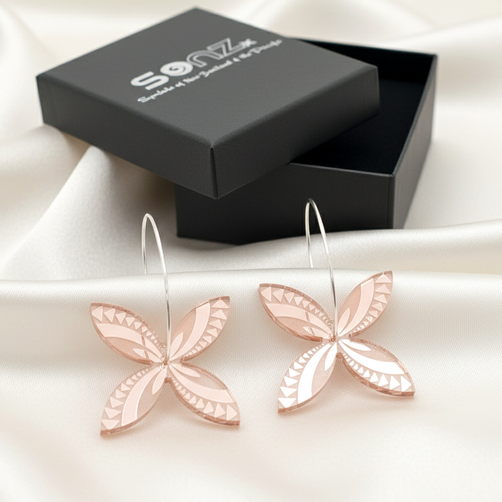 Frangipani Swirl hoop earrings in SoNZ gift box; rose-gold mirror acrylic with engraved lines.
