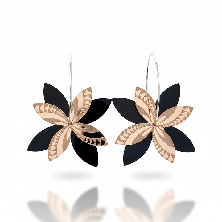 Frangipani Swirl Spinner earrings, layered blooms in rose-gold mirror acrylic with black acrylic petals on hoops.