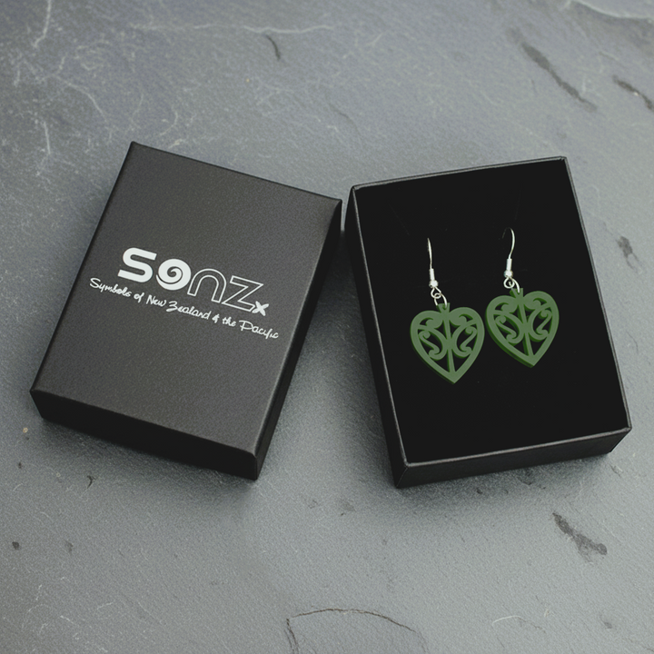 Kōwhaiwhai Heart earrings in a black SONZ gift box; pounamu satin open-heart with kōwhaiwhai cut-outs.