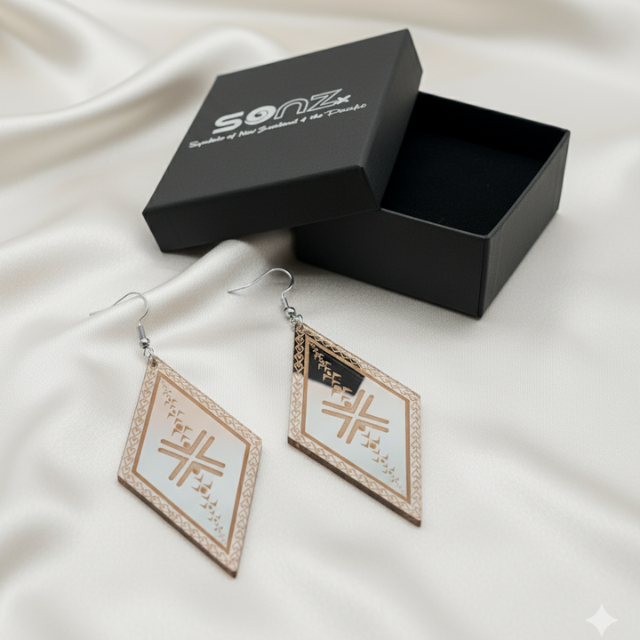 Malu Diamond earrings in SoNZ gift box; rose-gold mirror acrylic with engraved malu motifs.