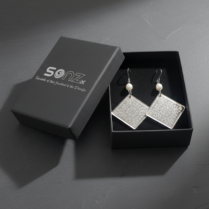 Monstera Diamond Pearl earrings in SoNZ gift box; silver mirror acrylic with freshwater pearl links.