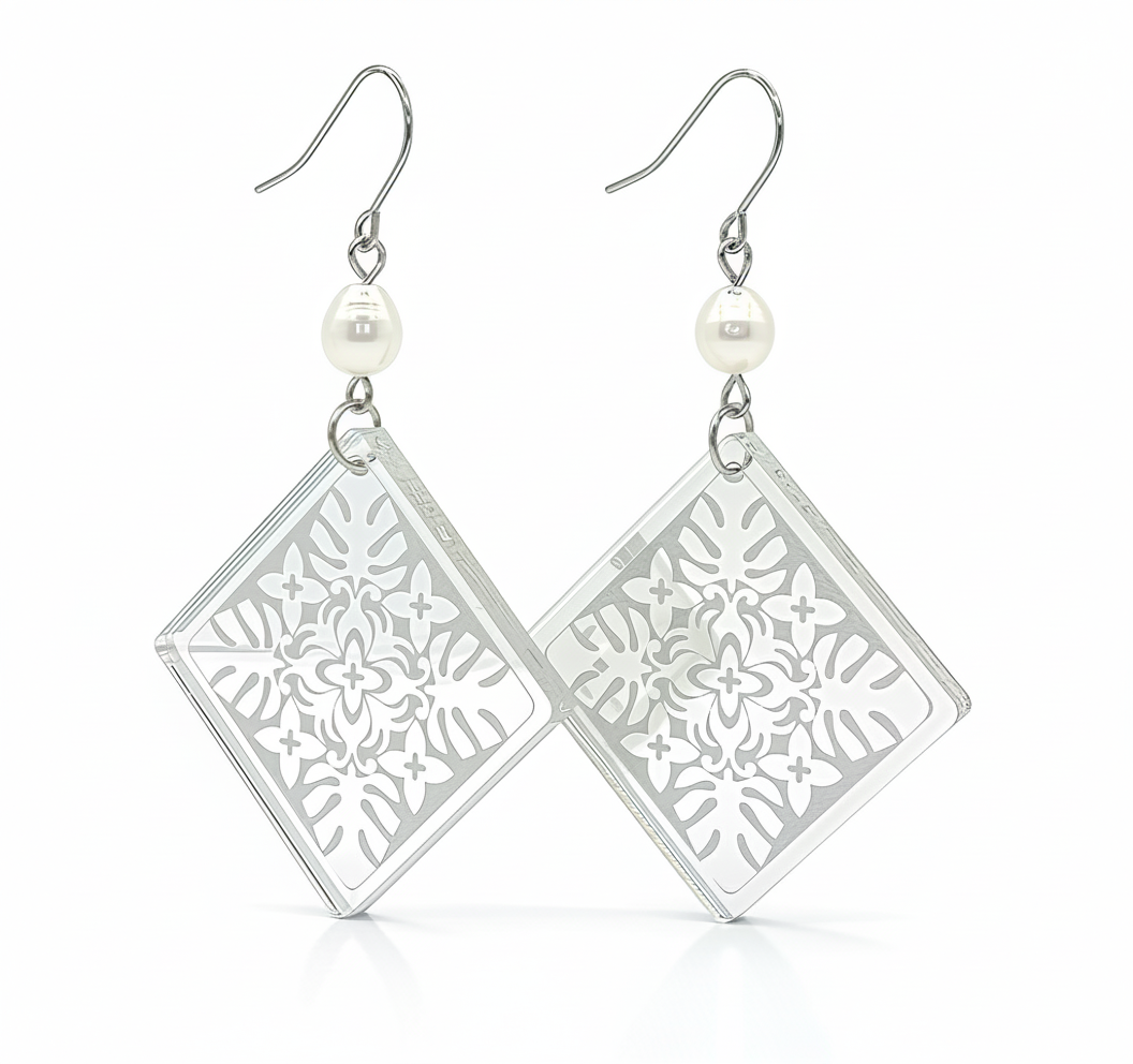 Monstera Diamond Pearl earrings, diamond silhouette with monstera lattice in silver mirror acrylic and a freshwater pearl link.