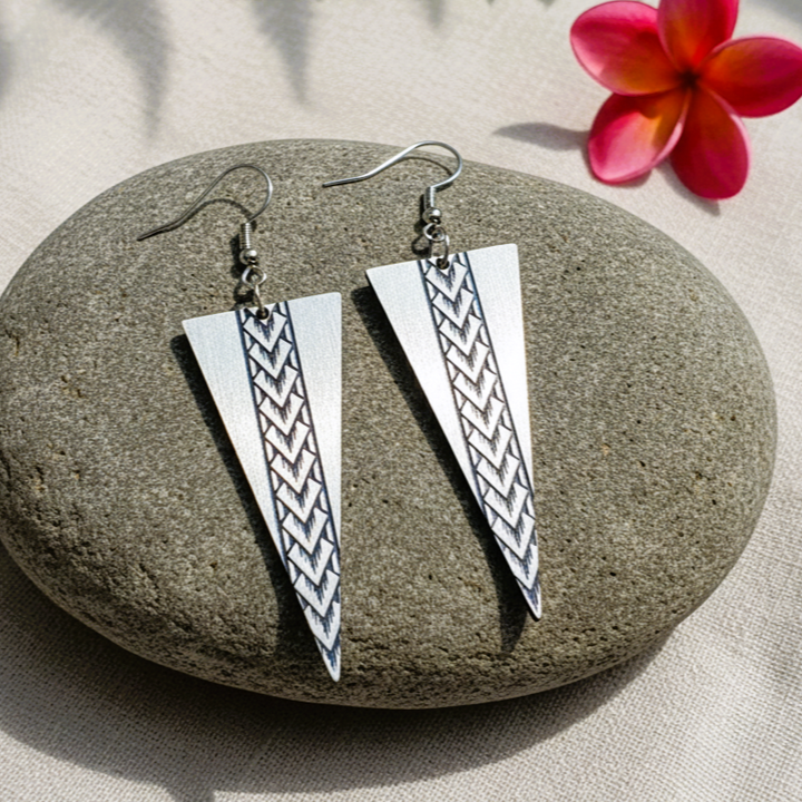 Samoan Spearhead earrings on stone; brushed silver metallic pair.