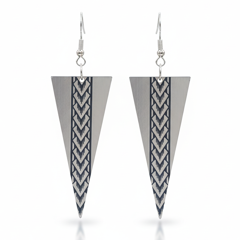 Samoan Spearhead earrings, tall tapered triangle with central Samoan engraving in brushed silver metallic.