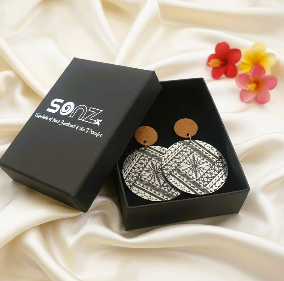 Samoan Tapa Round Wood Stud earrings in SoNZ gift box on silk; brushed silver metallic discs with natural wood studs.